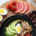 keto vs dopamine diet eggs, fruits, and avocado on a table keto diet vs intermittent fasting keto diet for depression and bipolar disorder