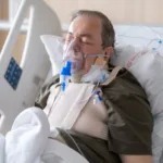 sick man in hospital and on oxygen